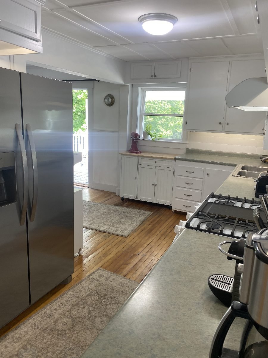 Kitchen with the door out to the deck